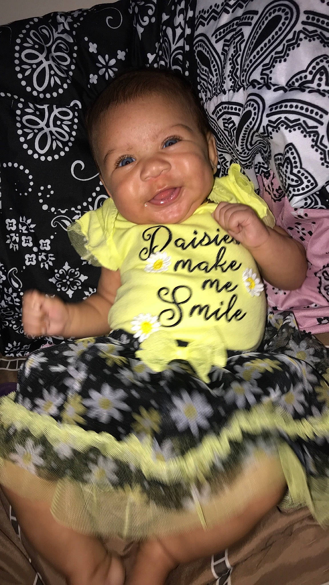 Khalani joined the competition — help win amazing prizes! arm, baby, baby_toddler_clothing, child, cool, couch, facial_expression, finger, flash_photography, fun, hairstyle, happy, mammal, pattern, person, pink, sitting, smile, textile, toddler