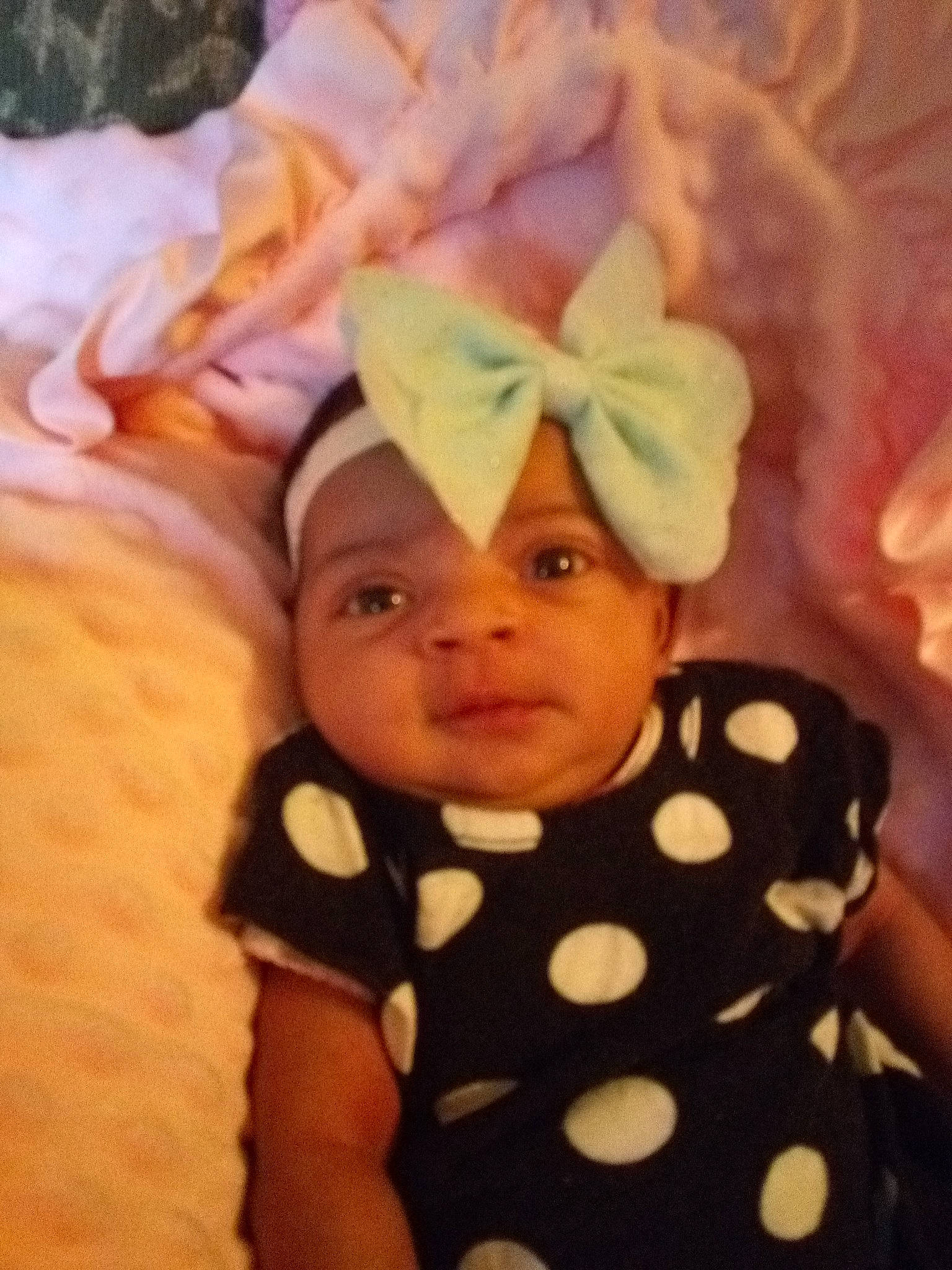 Odessa is registered to the contest to win money with this photo: baby, cheek, child, design, ear, hair_accessory, headgear, pattern, person, pink, toddler