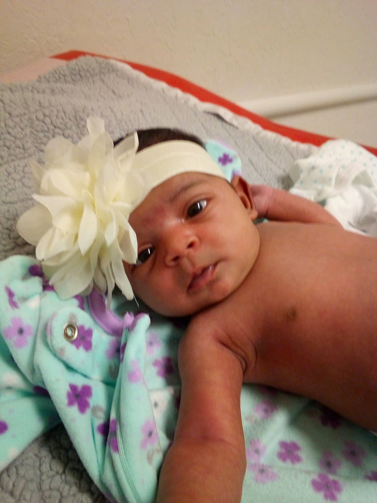 Odessa is registered to the contest to win money with this photo: baby, cheek, child, face, fashion_accessory, hair_accessory, hand, head, headband, headgear, headpiece, headwear, linens, person, photography, pink, skin, smile, toddler