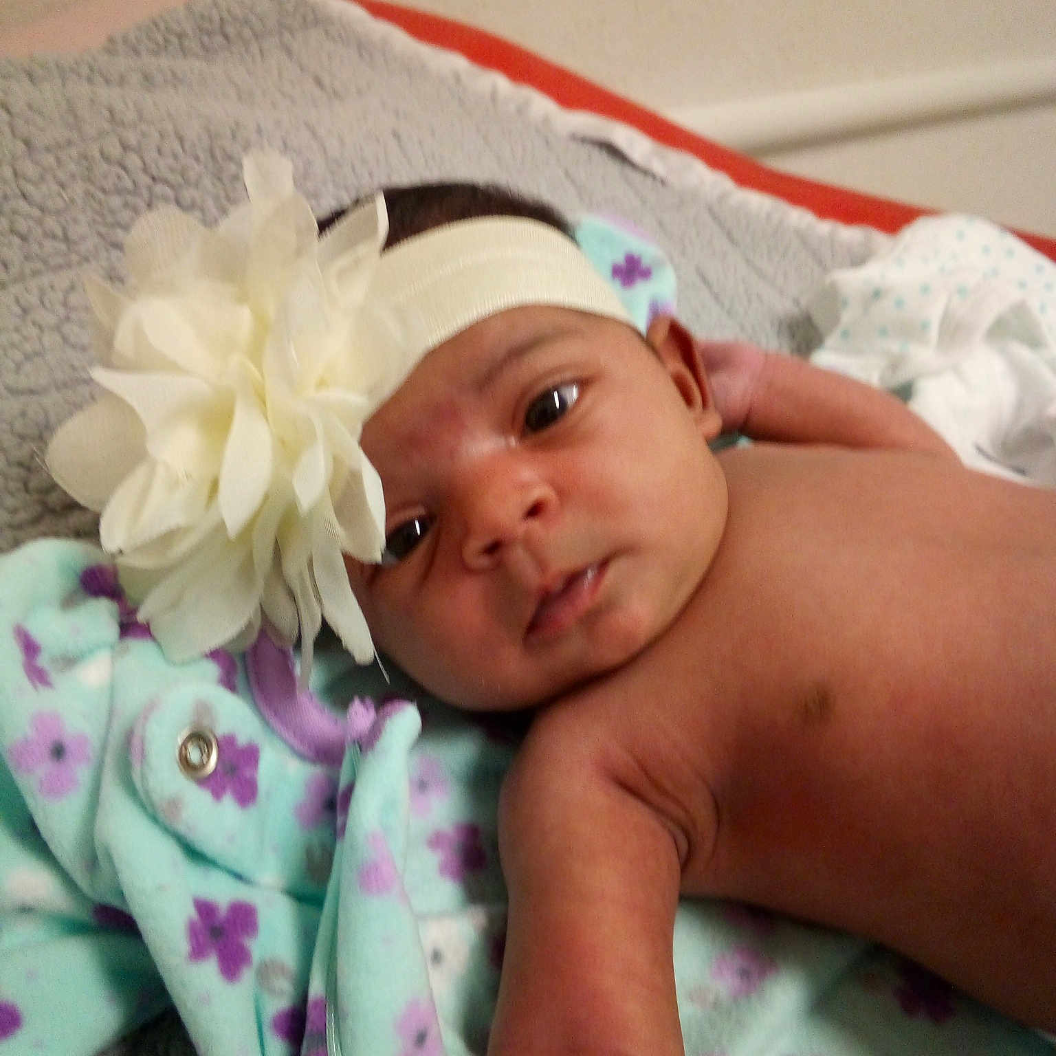 Odessa is registered to the contest to win money with this photo: baby, cheek, child, face, fashion_accessory, hair_accessory, hand, head, headband, headgear, headpiece, headwear, linens, person, photography, pink, skin, smile, toddler