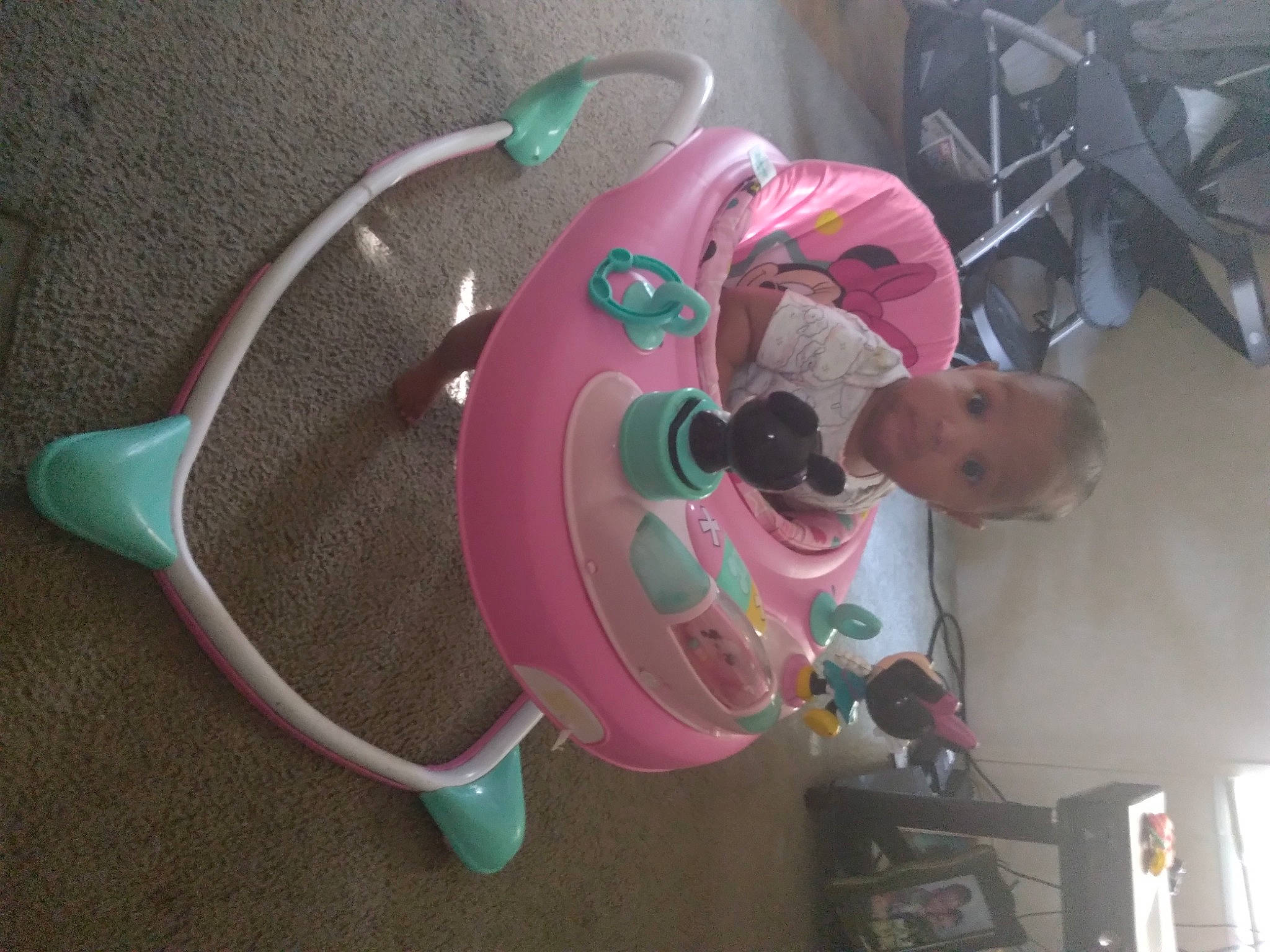 Jada is registered to the contest to win money with this photo: audio_equipment, auto_part, automotive_wheel_system, baby, baby_products, child, circle, drinkware, hat, headphones, machine, magenta, person, plastic, science, t_shirt, tire, toy, water, wheel