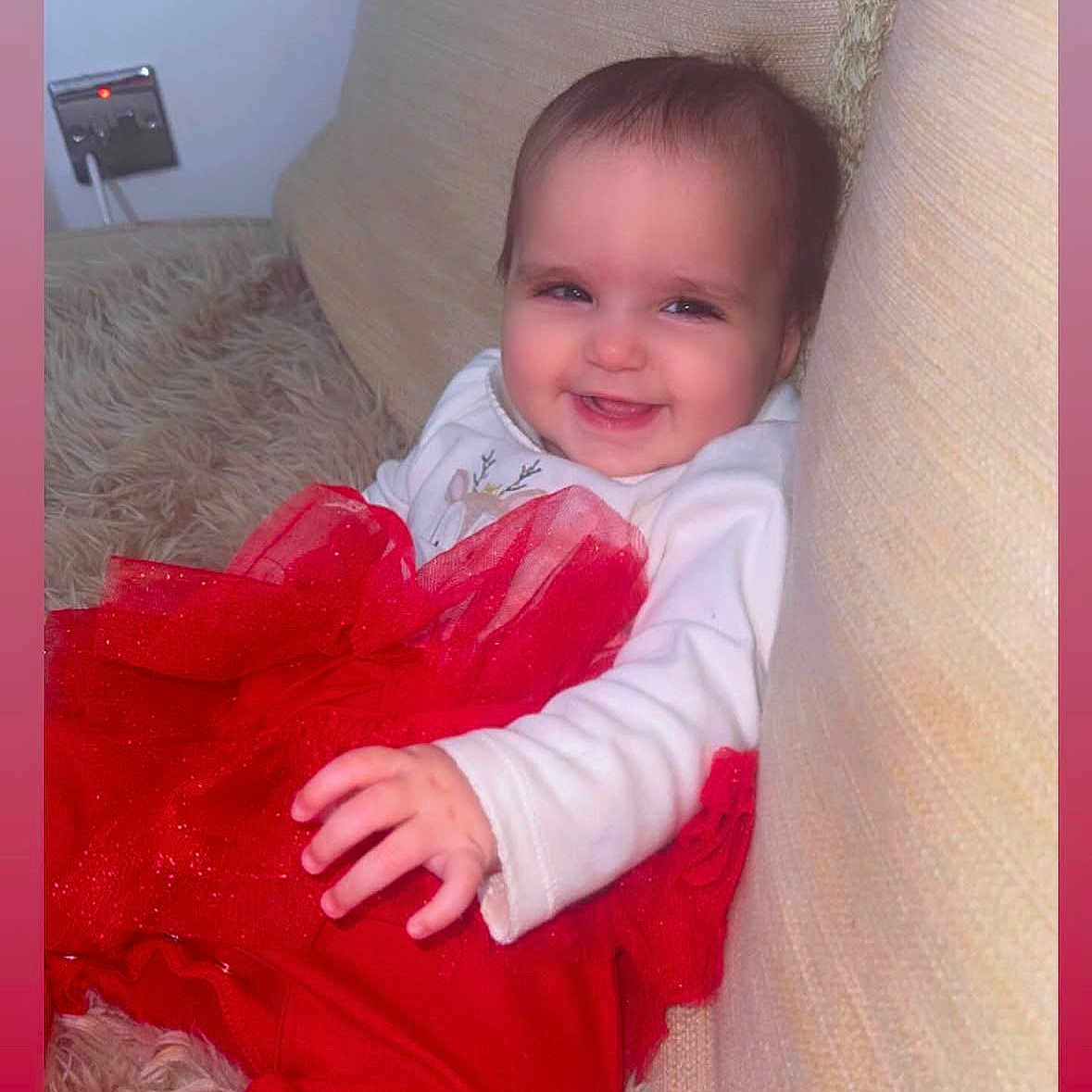 Ayisha is registered to the contest to win money with this photo: baby, babylaughing, bodypart, clothing, couch, cushion, dress, face, finger, furniture, happy, head, homedecor, indoors, laughing, pants, person, photography, portrait, smile