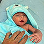 baby, infant, blue_towel, bear_hood, hand, skin, sleepy, cozy, soft_texture, protection, newborn, cute, wrapped, human, portrait, child, blanket, closeup, comfort, towel