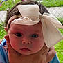 Abigail joined the competition — help win amazing prizes! baby, child, face, headband, bow, hand, outdoor, grass, fence, bicycle, portrait, closeup, person, young, cute, expression, skin, clothing, blue, holding