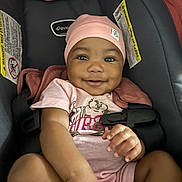 Deoni joined the competition — help win amazing prizes! baby, infant, car_seat, pink_hat, pink_onesie, smiling, happy, child, cute, portrait, indoor, seatbelt, clothing, face, hand, skin, young_child, baby_clothes, closeup, person