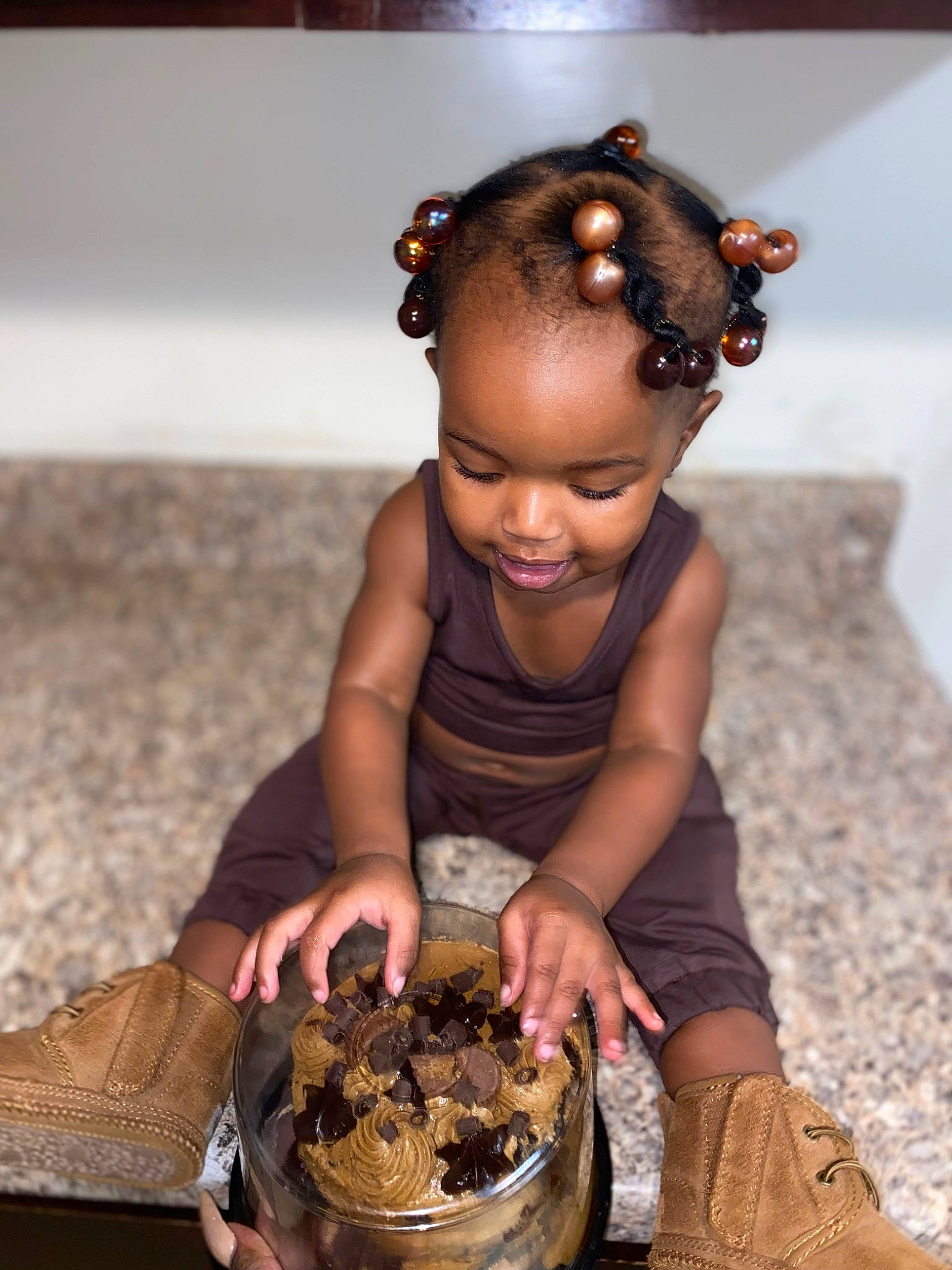 Yormani is registered to the contest to win money with this photo: baby_toddler_clothing, baking, child, chocolate, cuisine, dessert, dish, event, flash_photography, food, fun, ingredient, pastry, person, portrait_photography, sitting, snack, soil, sweetness, toddler