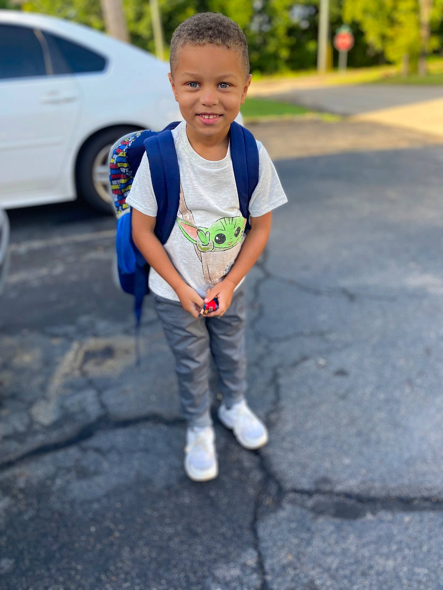 Jason joined the competition — help win amazing prizes! asphalt, automotive_tire, car, child, electric_blue, eye, grass, happy, joy, person, plant, public_space, road, road_surface, sidewalk, smile, t_shirt, tire, toddler, tree