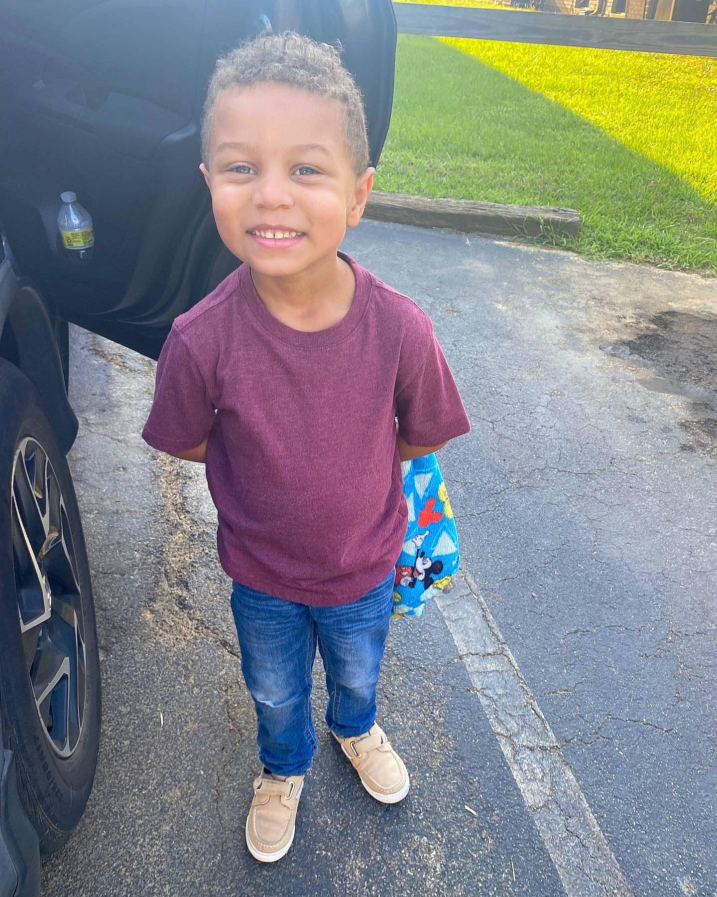 Jason joined the competition — help win amazing prizes! asphalt, automotive_design, automotive_exterior, automotive_lighting, automotive_tire, bumper, car, cool, electric_blue, fender, grass, happy, joy, motor_vehicle, person, smile, standing, tints_and_shades, tire, toddler