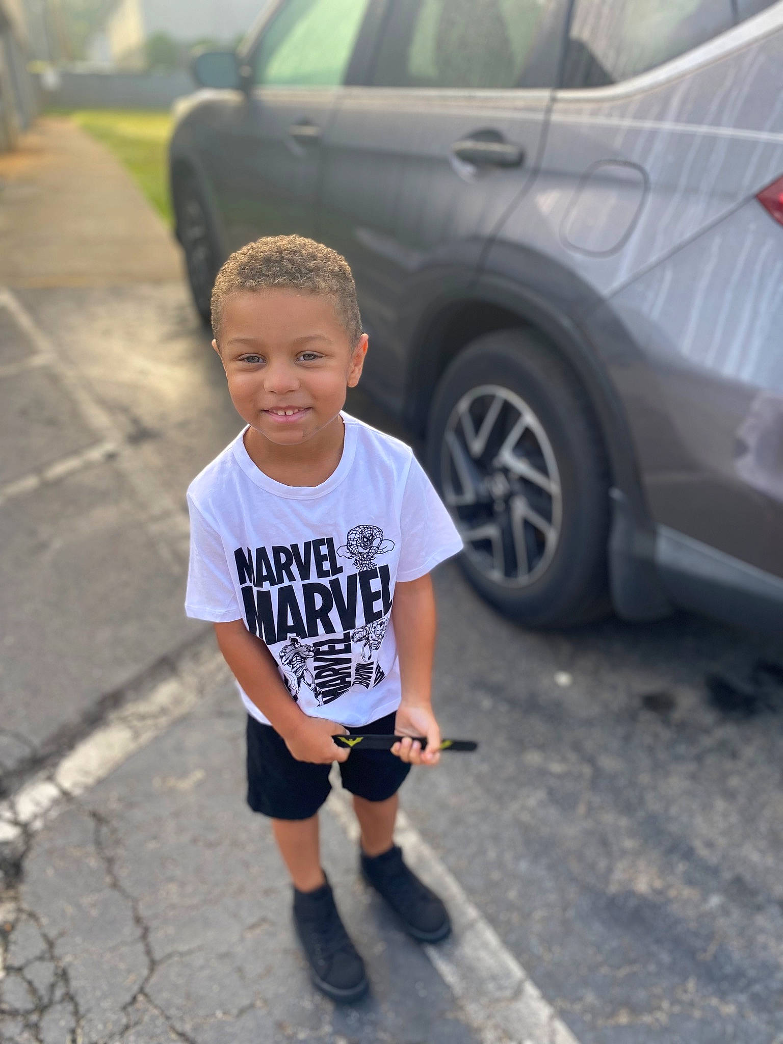 Jason joined the competition — help win amazing prizes! asphalt, automotive_design, automotive_exterior, automotive_lighting, automotive_tire, automotive_wheel_system, car, cool, joy, land_vehicle, mammal, motor_vehicle, person, road, shorts, snapshot, style, t_shirt, tire, vehicle