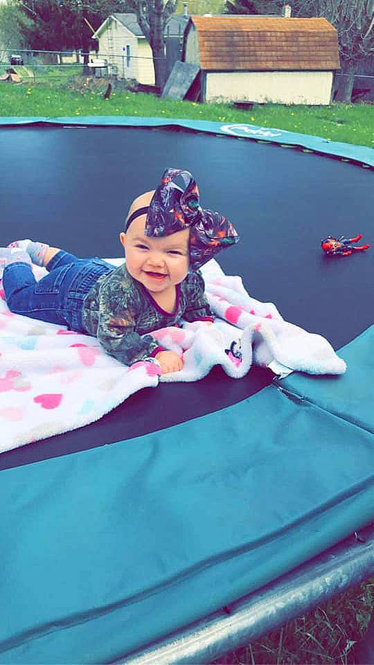 Braylee is registered to the contest to win money with this photo: child, fictional_character, games, grass, headwear, joy, leisure, person, photography, play, recreation, trampolining_equipment_and_supplies, vacation