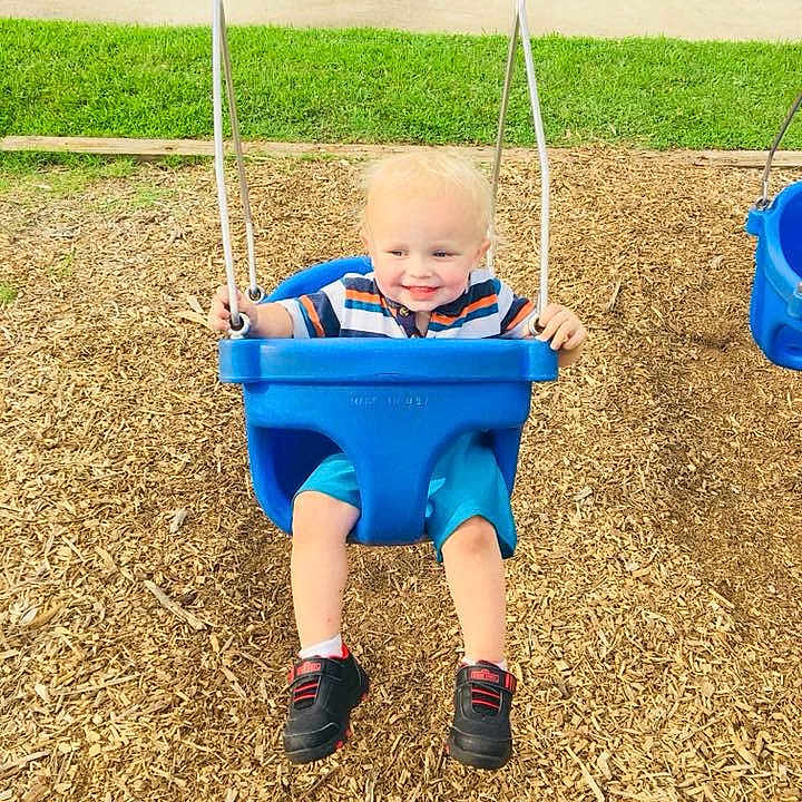 Carl is registered to the contest to win money with this photo: child, electric_blue, fun, joy, leisure, outdoor_play_equipment, person, play, playground, public_space, swing, toddler