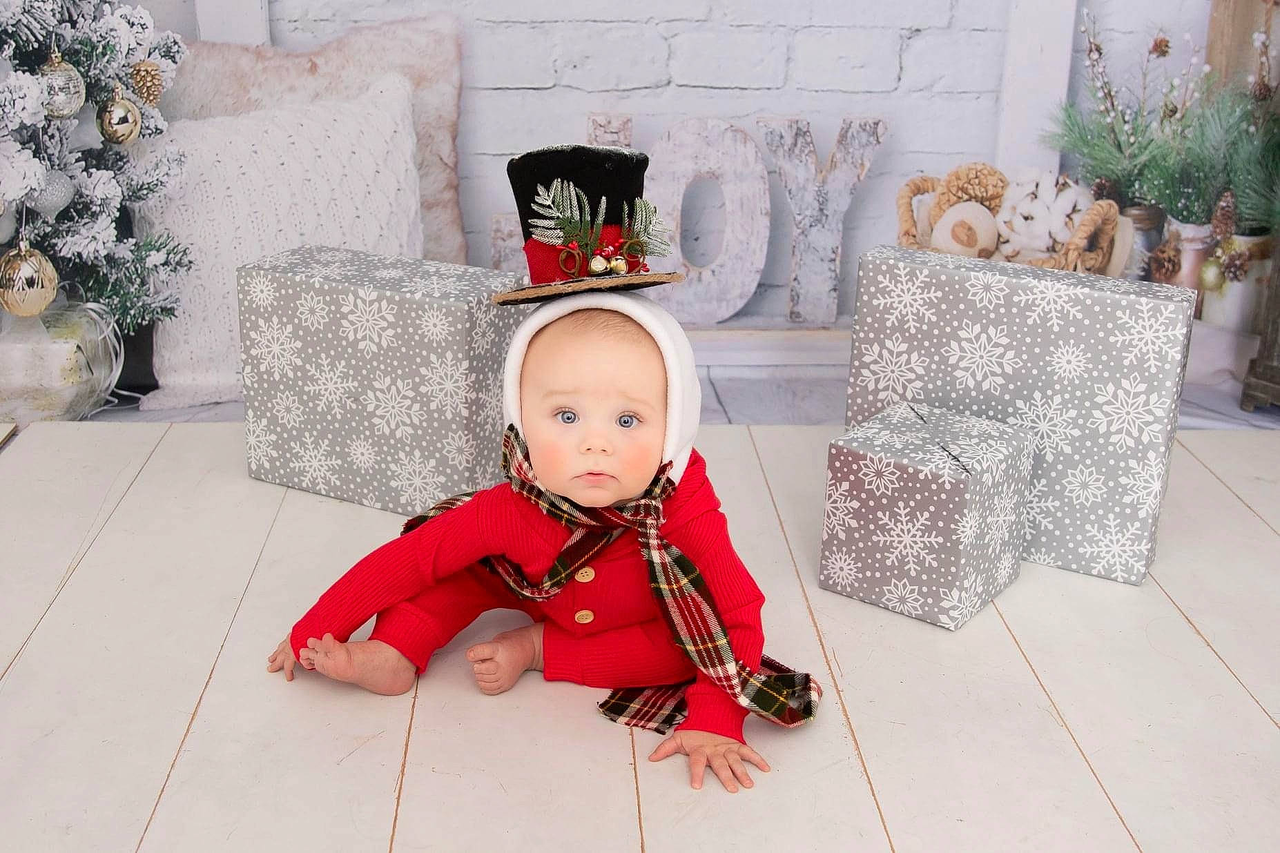 Baylor joined the competition — help win amazing prizes! baby, baby_toddler_clothing, child, christmas, costume_accessory, costume_hat, floor, flooring, flowerpot, home, houseplant, interior_design, living_room, natural_material, ornament, overall, person, tile, toddler