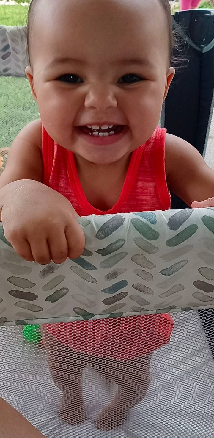 Journee joined the competition — help win amazing prizes! baby, baby_toddler_clothing, cheek, eye, face, finger, gesture, green, happy, joy, lip, nose, organ, people_in_nature, person, photograph, plant, red, skin, smile