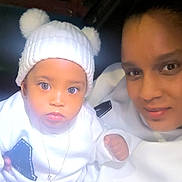 Ilyana a rejoint le concours — aidez-le/la à gagner de superbes lots ! adult, baby, black_pants, candid, car_interior, child, close_up, eyes, face, knit_hat, lip_gloss, necklace, night, person, pom_poms, portrait, warm_clothing, white_hat, white_sweater, window