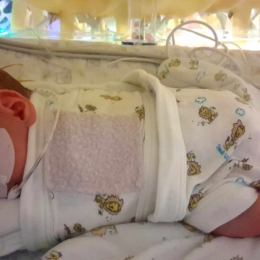 Caspen joined the competition — help win amazing prizes! baby, bed, blanket, child, clothing, cute, foot, healthcare, hospital, incubator, infant, lion, medical_tape, newborn, patient, pattern, resting, sleeping, tube, wrapped