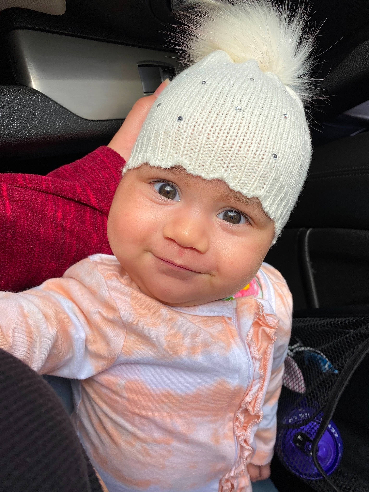 Romina joined the competition — help win amazing prizes! auto_part, baby, baby_toddler_clothing, cap, car_seat, cheek, child, chin, eye, eyebrow, fashion_accessory, happy, headgear, headwear, helmet, knit_cap, lip, magenta, person, pink