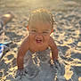 Theodore is registered to the contest to win money with this photo: toddler, child, beach, sand, sunlight, smiling, happy, crawling, wet_hair, outdoor, summer, play, sunset, face, hands, fun, sunshine, nature, cute, vacation