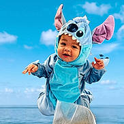 Theodore joined the competition — help win amazing prizes! toddler, child, costume, blue, stitch, ocean, sky, clouds, happy, jumping, playful, outdoor, cute, baby, face, ears, hands, water, fun, portrait