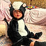 Tyrone joined the competition — help win amazing prizes! black_and_white, carpet, child, clothing, costume, couch, curious, cute, face, headwear, indoor, living_room, person, plush, portrait, sitting, skunk_costume, toddler, toy, young_child