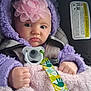 baby, blanket, blue_eyes, car_seat, child, closeup, clothing, cozy, facial_expression, flower_headband, hands, headband, hooded_jacket, infant, pacifier, portrait, purple, safety_label, seat_belt, soft_blanket