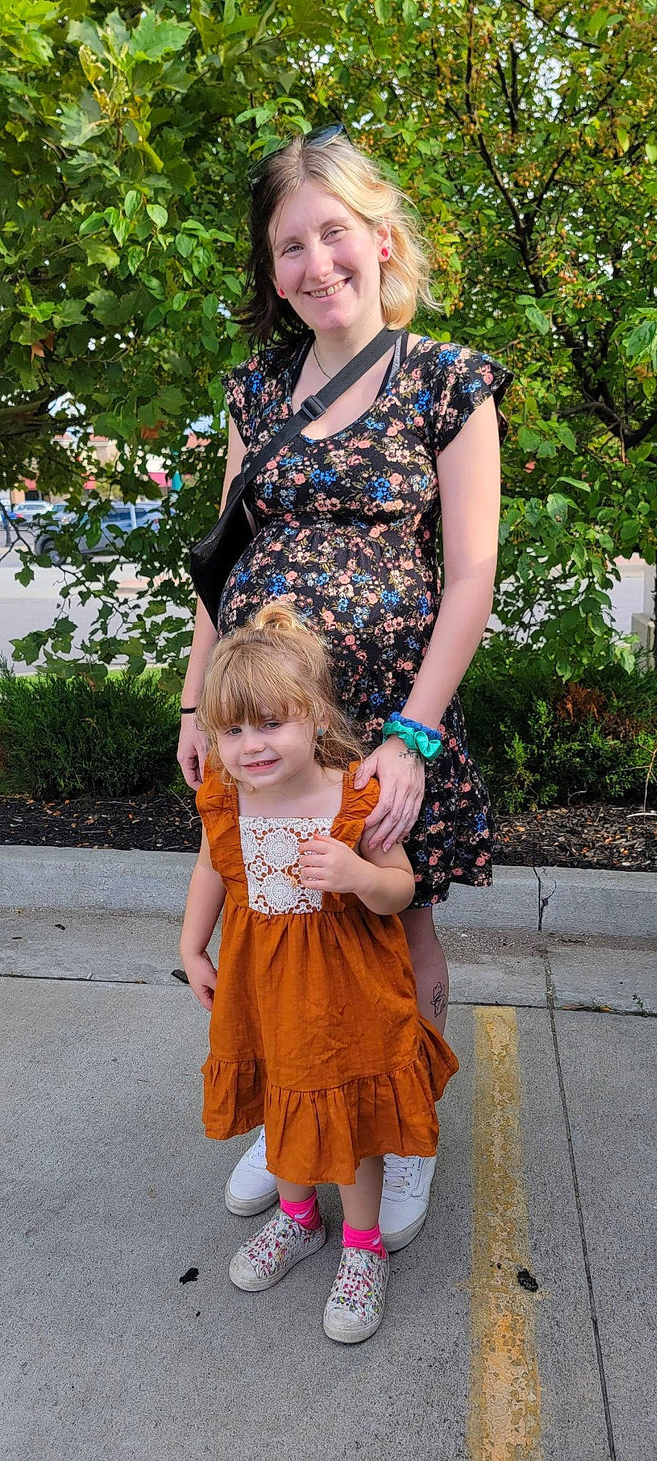 Brooklynn is registered to the contest to win money with this photo: botany, clothing, event, face, fun, grass, hand, happy, jewellery, joy, leisure, necklace, pattern, people, person, photograph, pink, plant, smile, summer