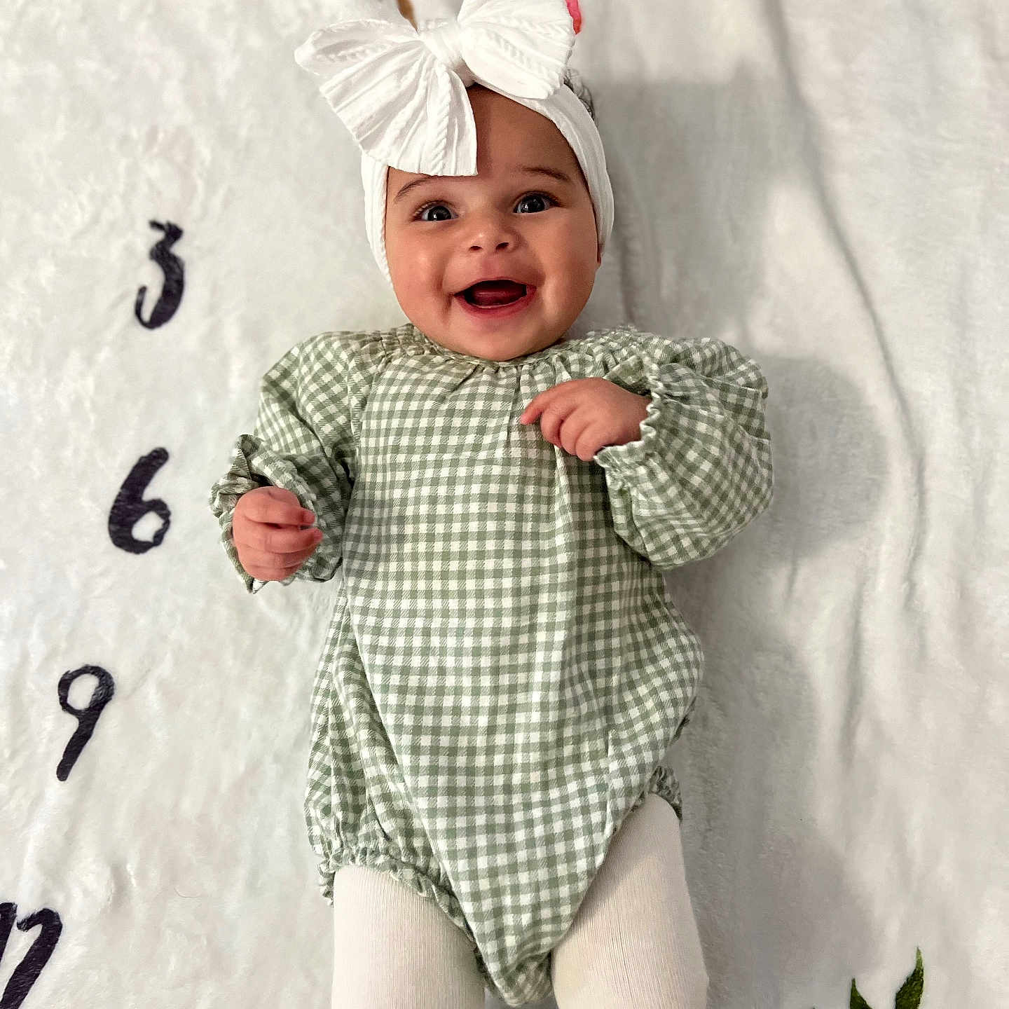 Leilani is registered to the contest to win money with this photo: accessories, baby, babylaughing, bodypart, bonnet, cap, clothing, costume, dress, face, finger, glove, hand, happy, hat, head, headband, jeans, jewelry, laughing