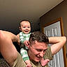Islamae joined the competition — help win amazing prizes! arms, baby, bonding, ceiling, child, door, family, green_checkered, happy, head, indoor, man, pajamas, person, playful, portrait, shoulders, skin, smiling, wall