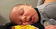 Jhire is registered to the contest to win money with this photo: baby, sleeping, pacifier, hand, face, clothing, skin, infant, rest, peaceful, young_child, closeup, cute, indoors, person, portrait, soft, texture, fabric, cozy