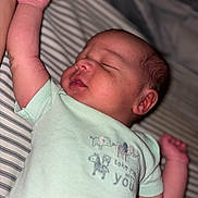 Jhire joined the competition — help win amazing prizes! baby, sleeping, infant, onesie, mint_green, striped_bed, raised_arm, peaceful, face, skin, hand, newborn, cute, portrait, child, clothing, resting, indoors, soft_light, closeup