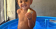 Jaden joined the competition — help win amazing prizes! toddler, child, pool, water, blue, smile, food, bread, indoor, curtain, light, shadow, skin, hair, sitting, play, fun, happy, summer, clothing