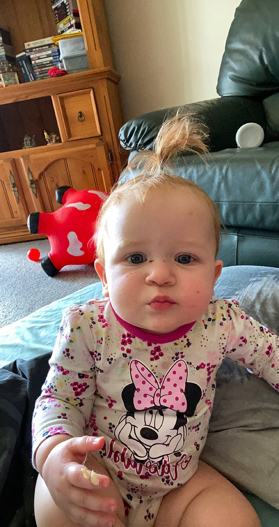 Laura is registered to the contest to win money with this photo: baby, baby_products, baby_toddler_clothing, baby_toys, bib, cabinetry, cheek, chest_of_drawers, cupboard, drawer, home, living_room, long_sleeved_t_shirt, overall, person, pink, room, shelf, shelving, toddler