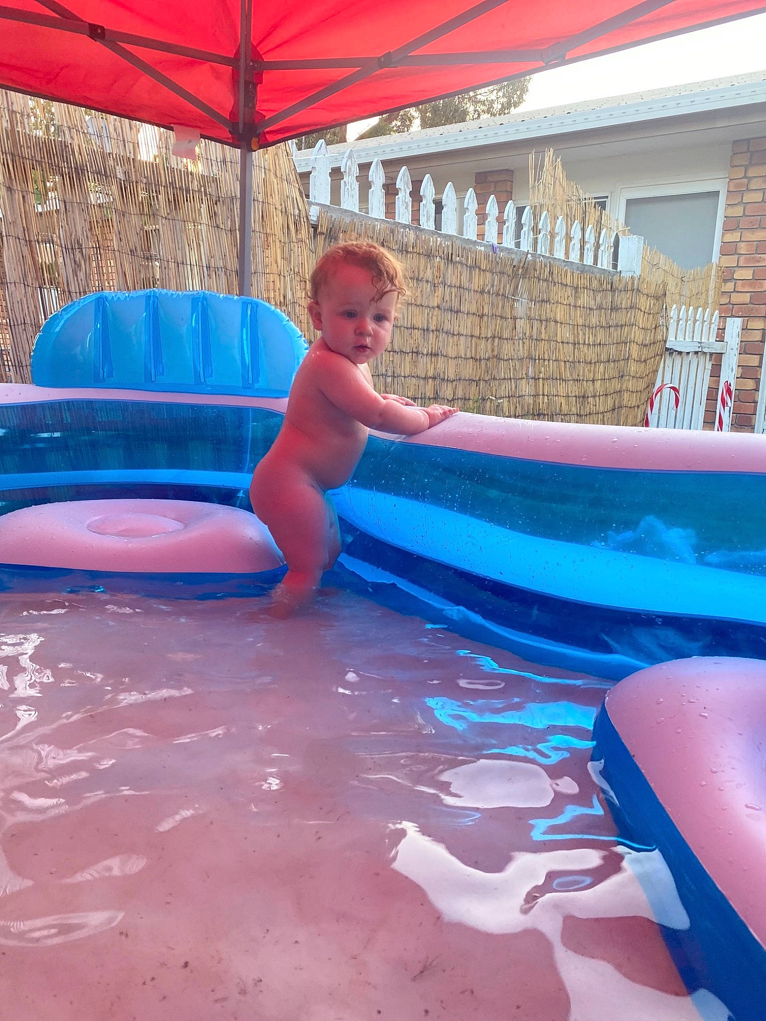 Laura is registered to the contest to win money with this photo: aqua, barechested, barefoot, bathing, fluid, foot, fun, inflatable, leisure, leisure_centre, outdoor_furniture, person, play, summer, swimming_pool, swimwear, toe, water