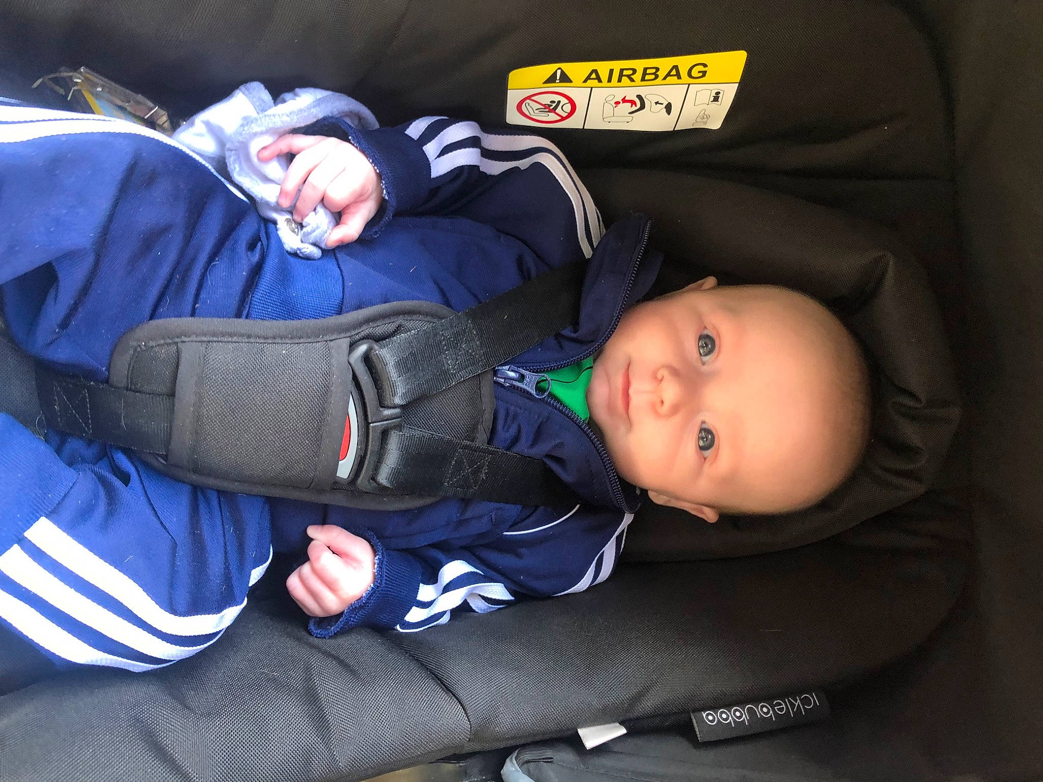 Lj is registered to the contest to win money with this photo: auto_part, baby, baby_carriage, baby_in_car_seat, baby_products, baby_safety, baby_toddler_clothing, bag, car_seat, child, comfort, electric_blue, headgear, lap, nap, person, personal_protective_equipment, sitting, sleep, sleeve