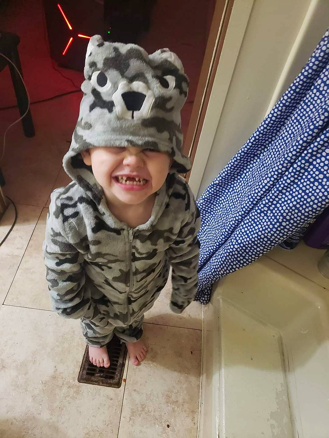 Mason is registered to the contest to win money with this photo: camouflage, cap, chair, child, curtain, flooring, fun, fur, happy, headwear, joy, military, military_camouflage, military_person, military_uniform, pattern, person, personal_protective_equipment, sleeve, smile