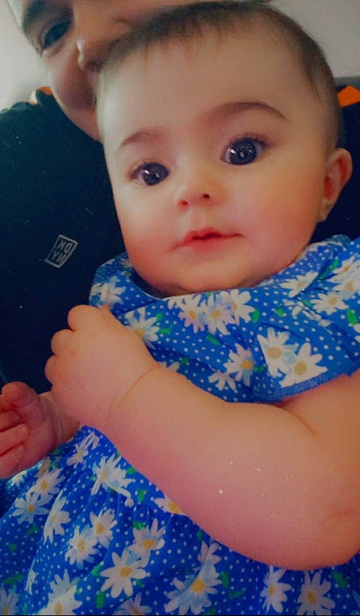 Briana joined the competition — help win amazing prizes! arm, azure, baby_toddler_clothing, blue, cheek, chin, eyebrow, eyelash, face, gesture, hand, happy, iris, lip, mouth, neck, nose, person, shoulder, skin