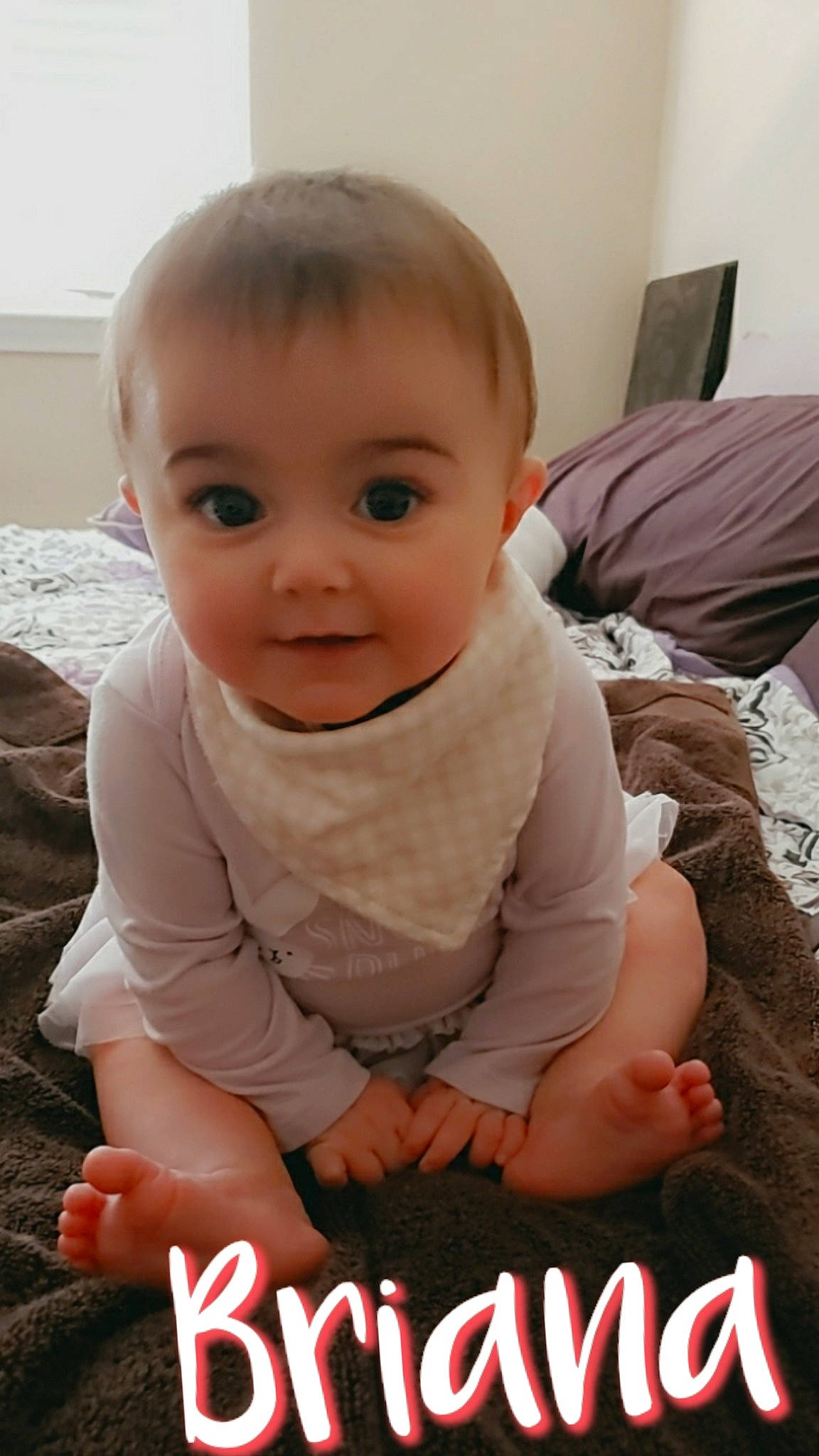 Briana joined the competition — help win amazing prizes! baby, baby_toddler_clothing, cheek, child, comfort, facial_expression, finger, flooring, fun, happy, human, person, photo_caption, sitting, skin, sleeve, smile, t_shirt, toddler, tummy_time