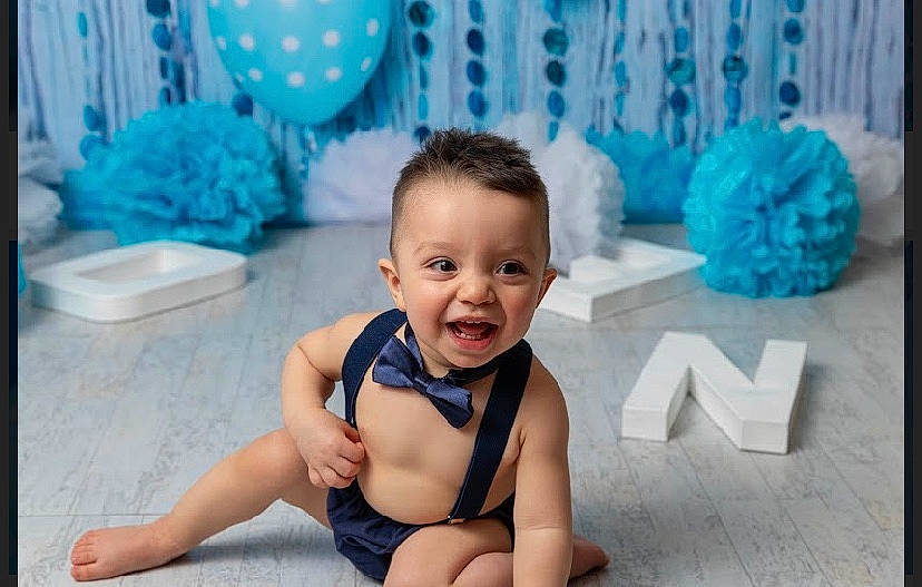 Luis joined the competition — help win amazing prizes! baby, baby_toddler_clothing, blue, child, fun, happy, leisure, person, play, sitting, smile, sportswear, toddler, turquoise
