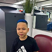 Leandry joined the competition — help win amazing prizes! child, boy, blue_hair, haircut, barber_shop, mirror, plant, chair, black_shirt, adidas, indoor, portrait, smile, hairstyle, person, casual, young, fashion, furniture, reflection