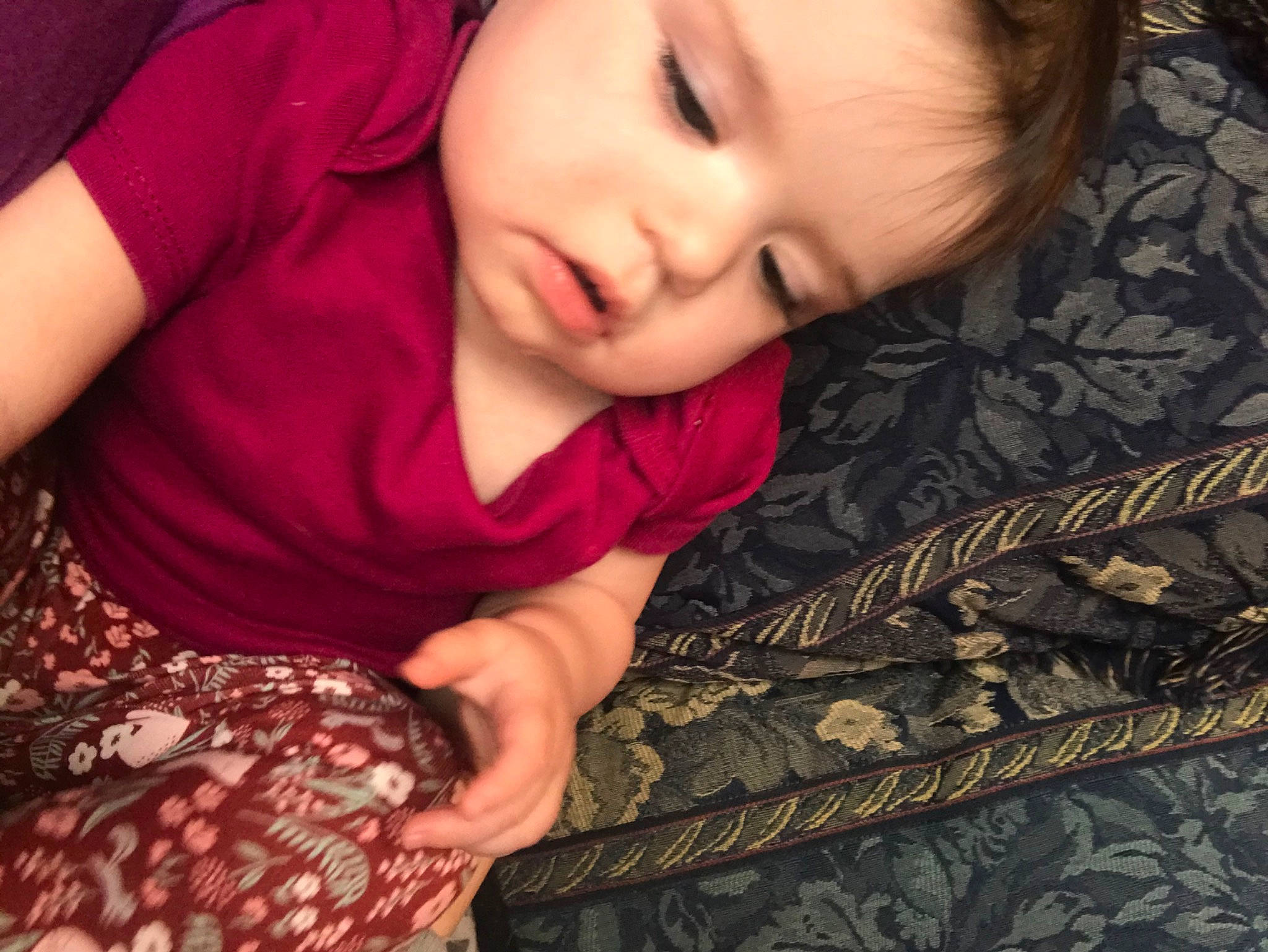 Brooklyn is registered to the contest to win money with this photo: arm, baby_toddler_clothing, black, cheek, comfort, eye, eyelash, gesture, hand, head, human, iris, lip, mammal, neck, nose, organ, person, skin, sleeve