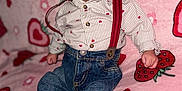 Ivan joined the competition — help win amazing prizes! baby, infant, striped_shirt, red_suspender, denim_pants, pink_blanket, strawberry_pattern, heart_pattern, barefoot, cute, portrait, indoor, child, clothing, person, small_hands, small_feet, sitting, curious, soft_texture