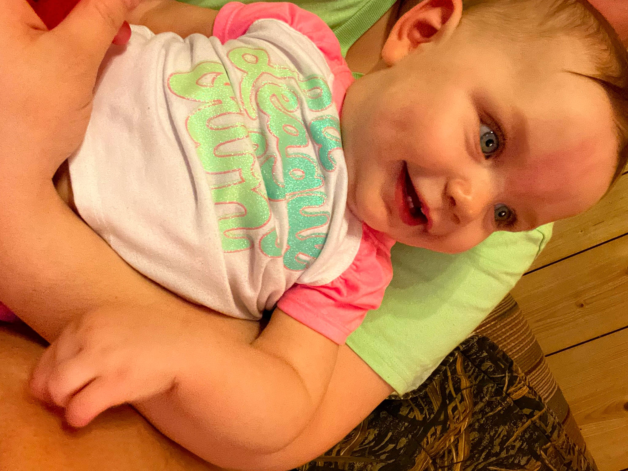 Emma is registered to the contest to win money with this photo: baby, baby_toddler_clothing, cheek, eye, face, facial_expression, finger, gesture, hand, happy, human_body, joy, lip, mammal, mouth, muscle, neck, nose, person, skin