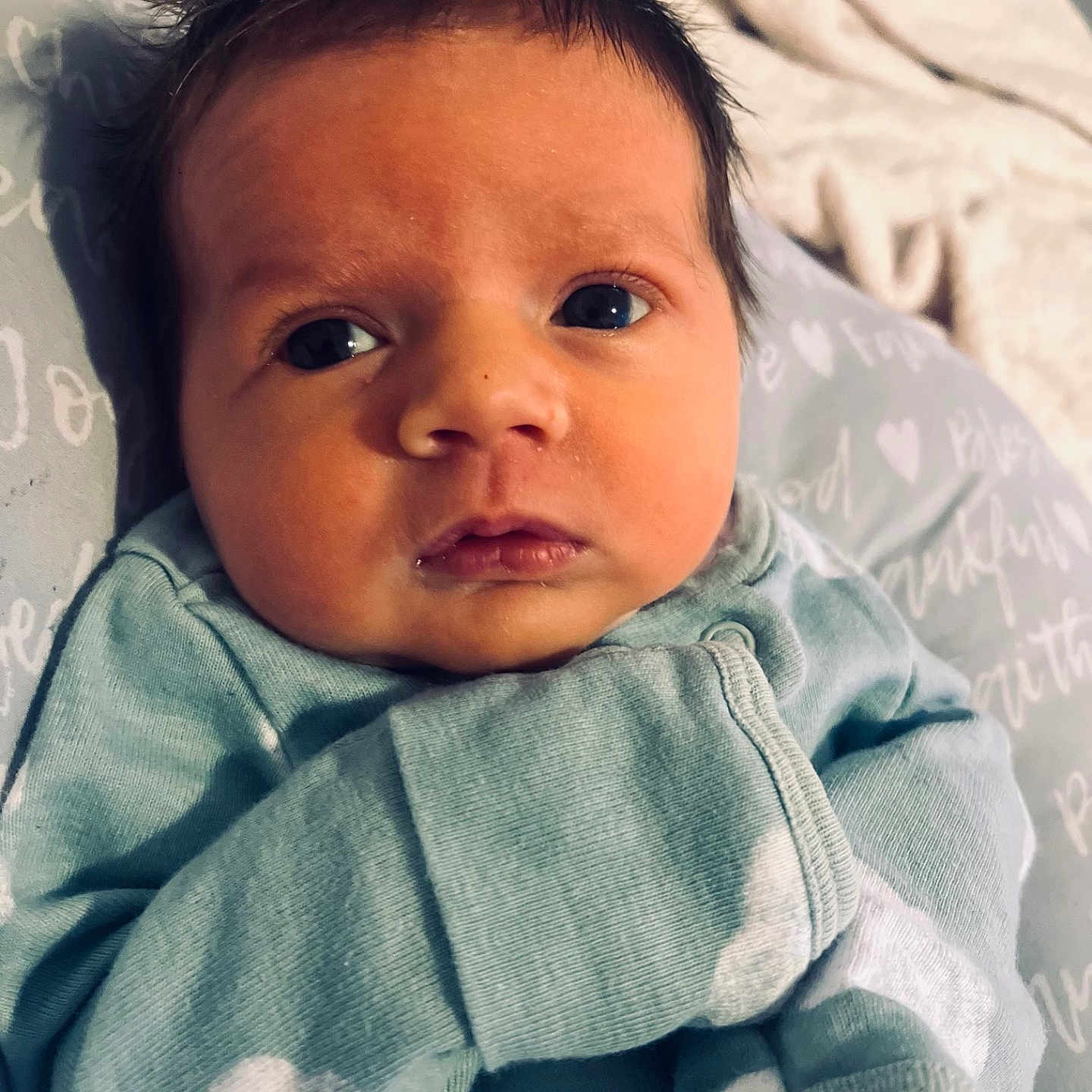 Banx is registered to the contest to win money with this photo: baby, blanket, clothing, cushion, face, happy, head, homedecor, newborn, person, photography, portrait, sleeve, smile