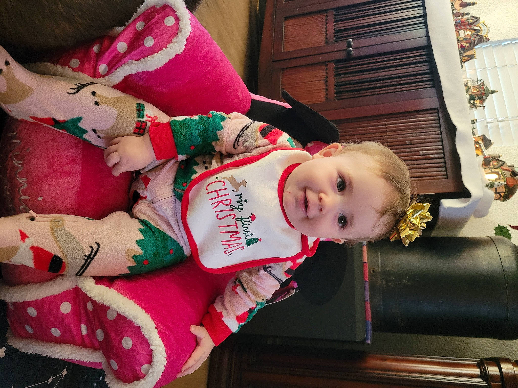 Kendall joined the competition — help win amazing prizes! baby, baby_toddler_clothing, carmine, child, christmas, christmas_eve, event, fun, happy, holiday, human_leg, lap, pattern, person, sitting, smile, sock, thigh, toddler, tree
