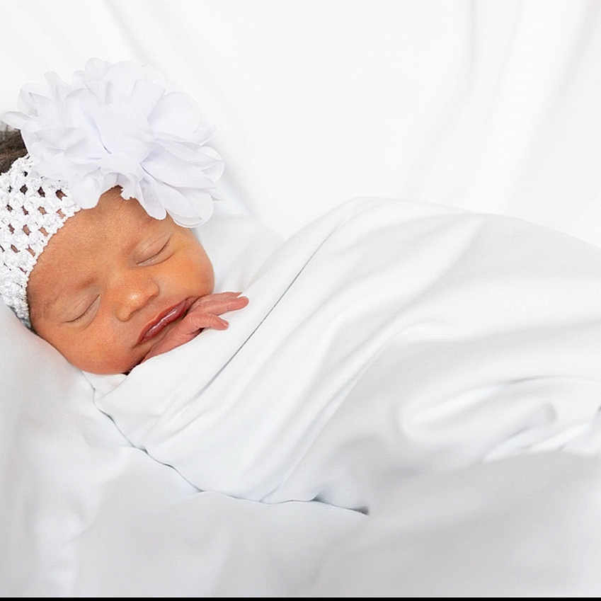 Sakara joined the competition — help win amazing prizes! accessories, baby, bed, blanket, bonnet, clothing, face, furniture, glove, hat, head, headband, newborn, person, photography, portrait, sleeping, white