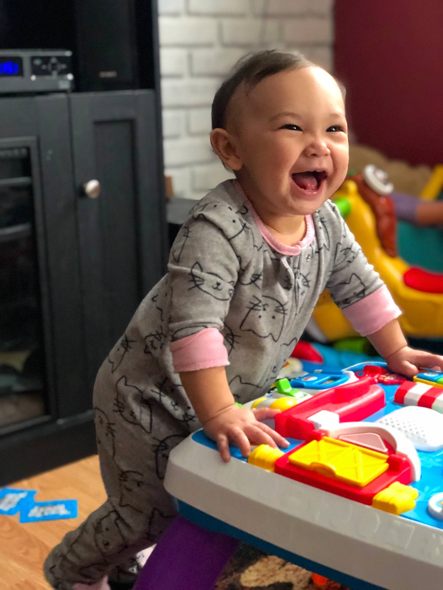 Meela is registered to the contest to win money with this photo: baby, baby_playing_with_toys, baby_toys, child, fun, person, play, room, sitting, toddler, toy