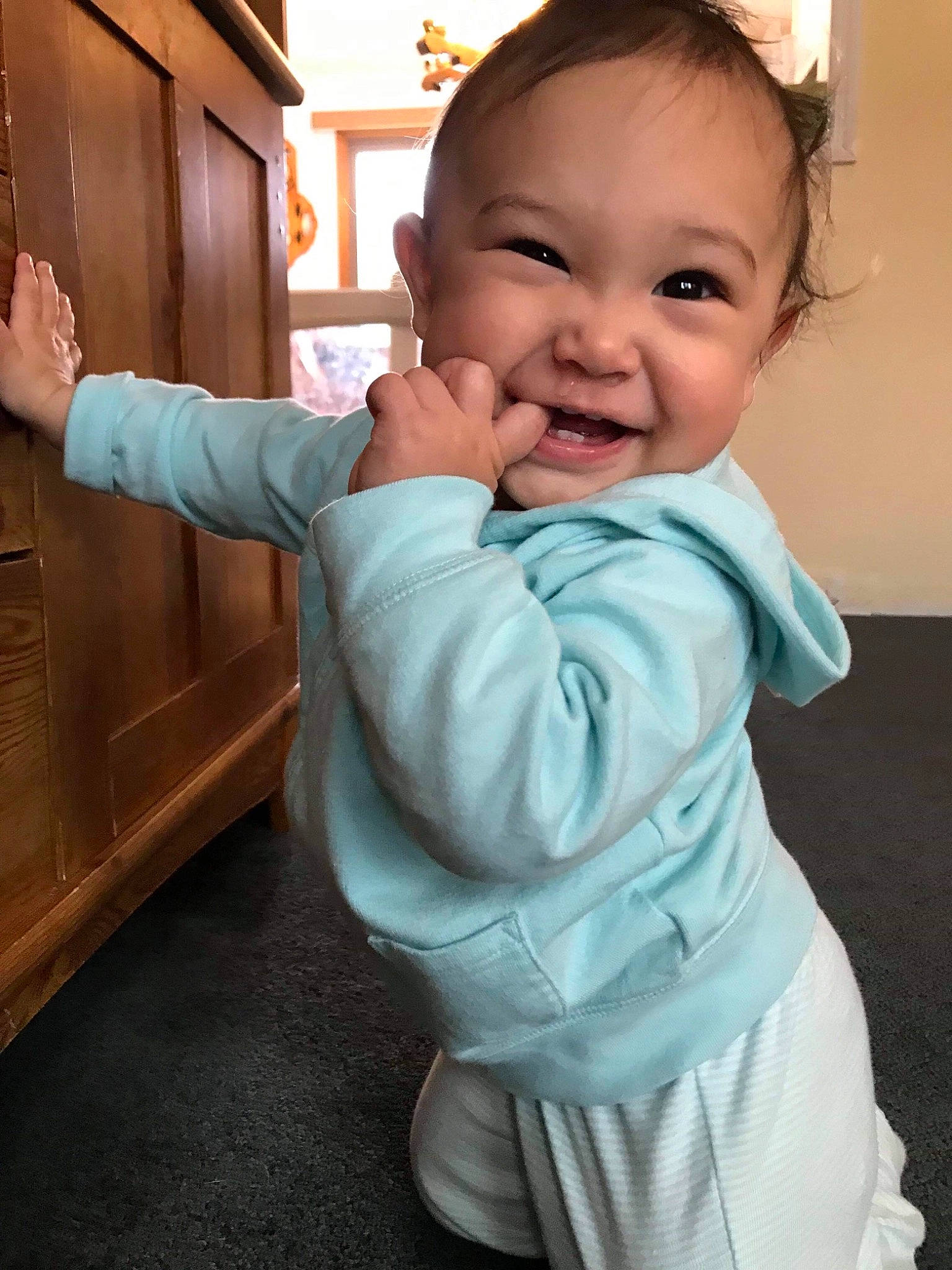 Meela joined the competition — help win amazing prizes! arm, baby, cheek, child, finger, gesture, hand, happy, head, joy, neck, person, skin, smile, standing, thumb, toddler