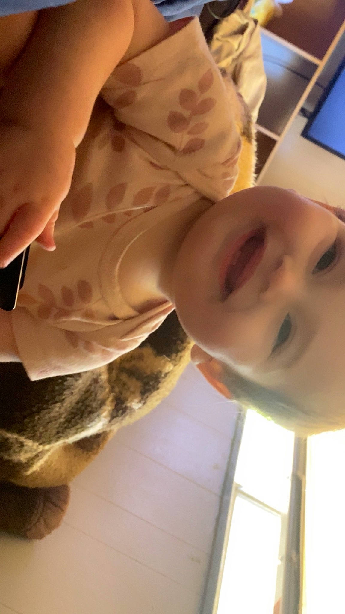Callie is registered to the contest to win money with this photo: baby, chin, close_up, finger, fun, gesture, happy, human_leg, jaw, joy, mammal, mouth, neck, nose, pattern, person, skin, smile, thumb, toddler