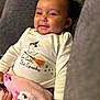 baby, smiling, infant, blanket, pink, cute, shirt, halloween, witch_hat, broom, stars, indoor, couch, cozy, child, happy, portrait, clothing, person, hand