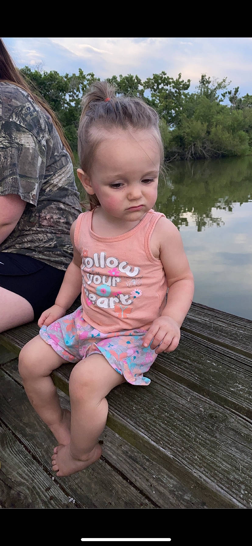 Rayleigh is registered to the contest to win money with this photo: baby, baby_toddler_clothing, child, face, fun, grass, happy, head, human_body, lake, leisure, person, pink, shoulder, skin, summer, t_shirt, thigh, toddler, tree