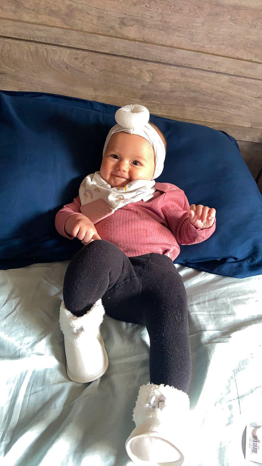 Ila joined the competition — help win amazing prizes! baby, baby_toddler_clothing, cheek, child, comfort, couch, face, hat, head, headwear, human_body, human_leg, joy, knee, lap, person, room, sitting, sleeve, smile